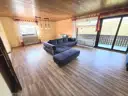 Wohnzimmer mit Zugang Balkon EG