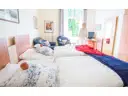 Doppelzimmer mit Balkon zum Garten