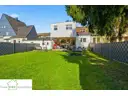 Garten Rückansicht Haus, Zweifamilienhaus mit Garage zum Kauf in Düsseldorf Hassels, Frank Ewe Immobilienmakler Düsseldorf Hassels