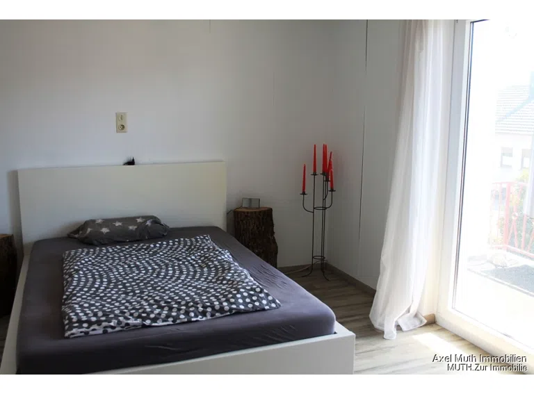 Schlafzimmer mit Balkon