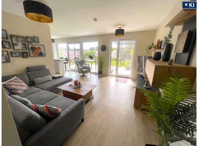 Wohnzimmer mit offener Wohnküche