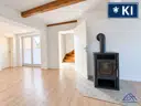 Wohnzimmer mit Ofen - Lütt Immobilien Malente