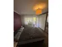 14 Schlafzimmer mit Balkonzugang