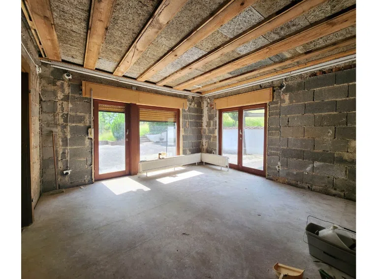 EG Anbau mit bodentiefen Fenstern und Zugang zu Terrasse und Garten