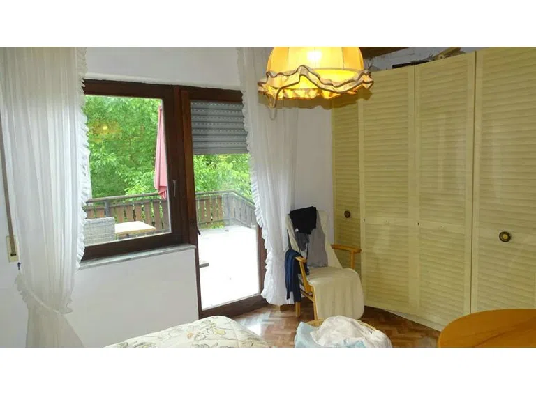 Schlafzimmer mit Balkontür